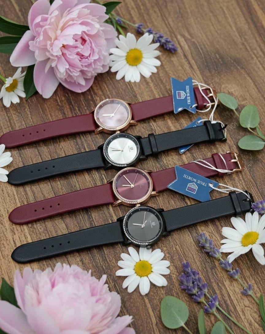 True worth Olivia Burton women's watch featuring a mint-colored leather strap, a white dial with a silver bezel, and CRYSTAL.